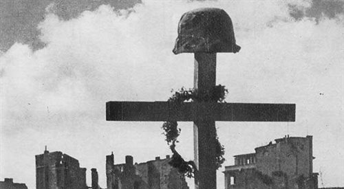 Mogiła polskiego żołnierza na gruzach Warszawy