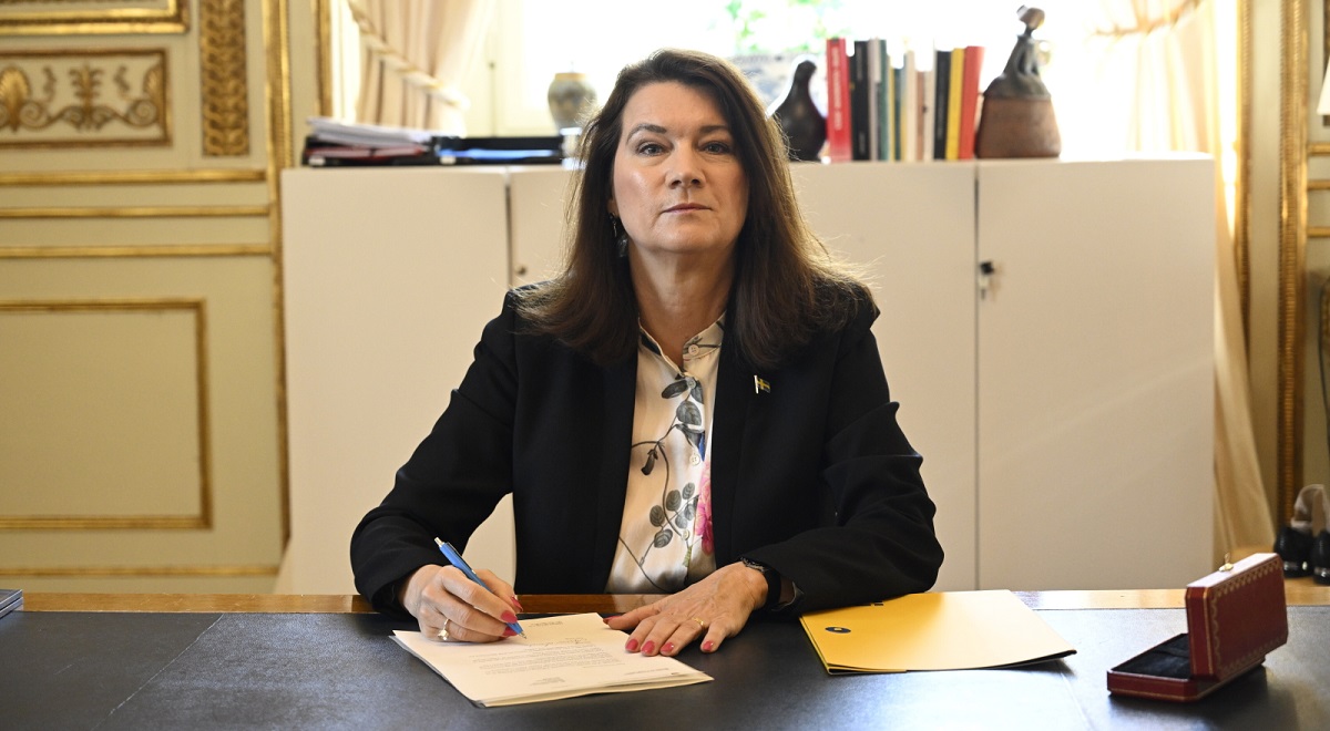 Sweden's Foreign Minister Ann Linde signs her country's application for NATO membership in Stockholm on Tuesday, May 17, 2022.