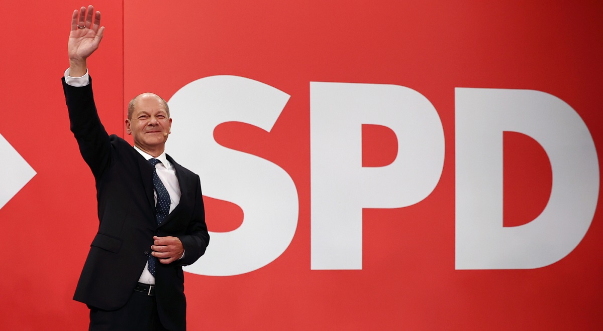 The German Social Democrats (SPD) candidate for chancellor, Olaf Scholz, waves to supporters on election night in Berlin.