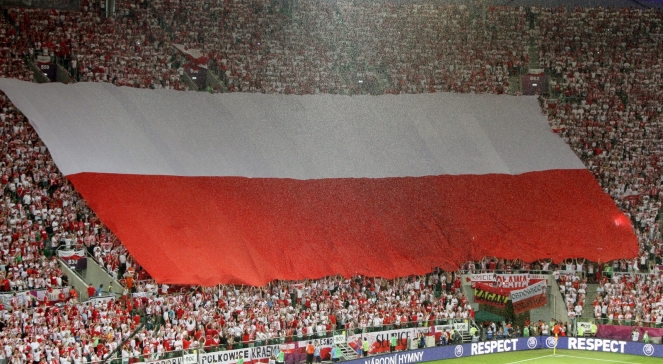 Flaga Tomasza Zimocha na stadionie