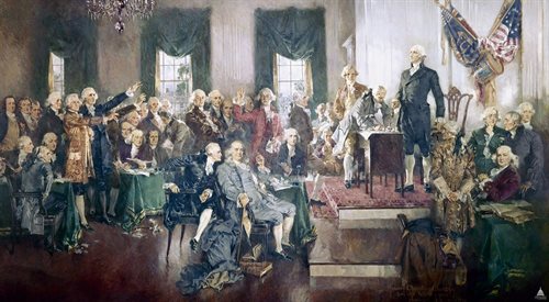 Moment podpisania amerykańskiej konstytucji na obrazie Howarda Chandlera Christyego