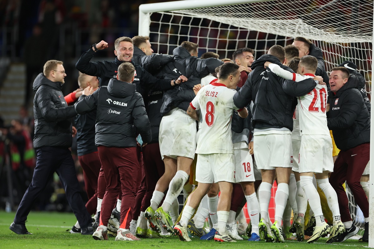 Polish soccer players celebrate on Tuesday after qualifying for the Euro 2024 tournament in Germany.